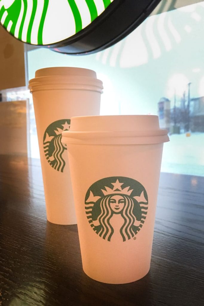 two starbucks hot cups