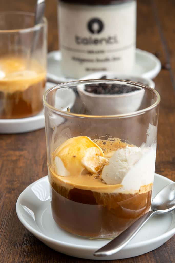 Two cups with espresso poured over vanilla gelato.