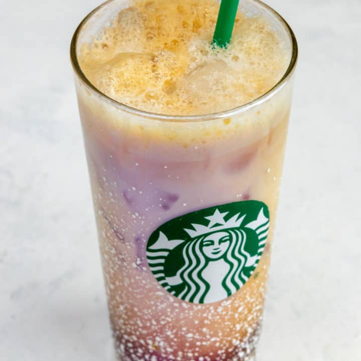 Homemade Iced Shaken Espresso in Starbucks glass with straw.