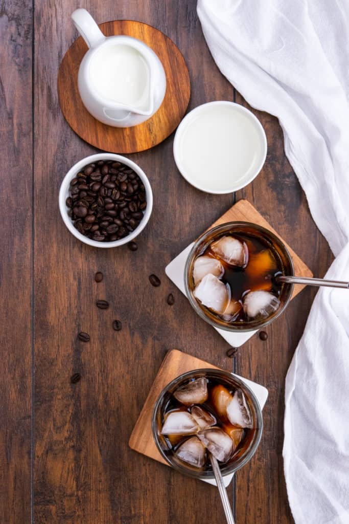 two glasses filled with cold brew coffee and ice