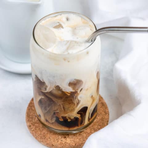 homemade vanilla sweet cream in a cup of cold brew coffee