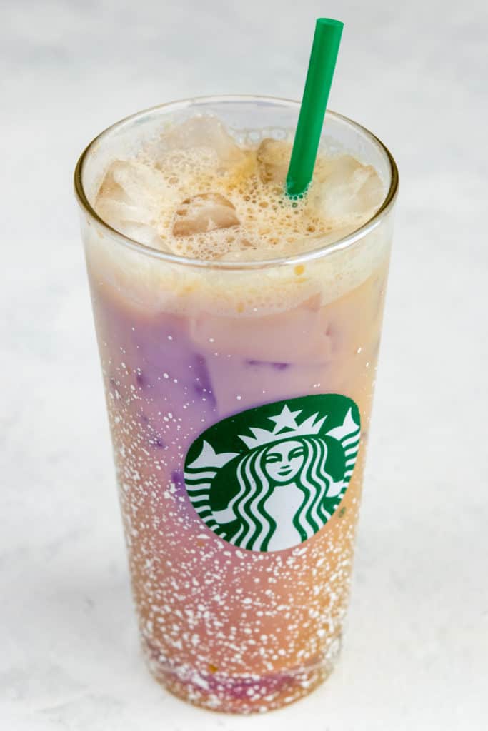 Homemade Iced Shaken Espresso in Starbucks glass with straw.