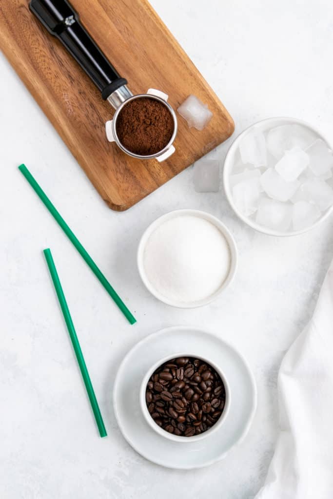 Starbucks blonde roast coffee beans in an espresso portafilter.