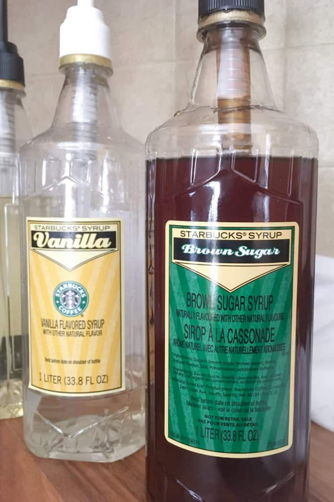 Bottle of Starbucks brown sugar syrup next to vanilla syrup.