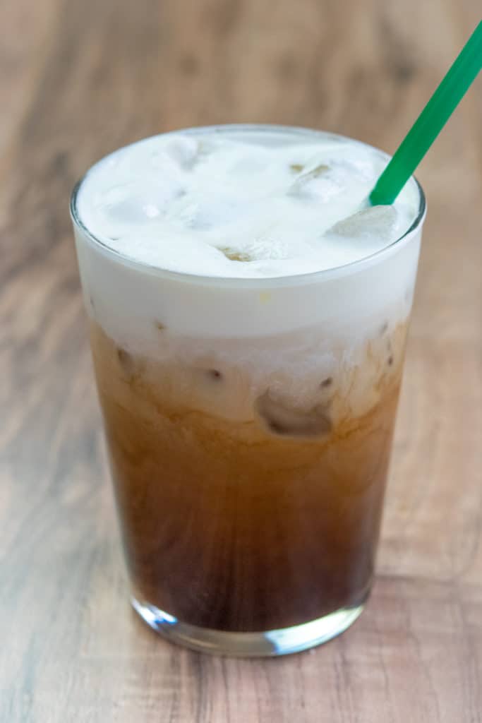 Starbucks Salted Caramel Cold Brew drink with green straw.