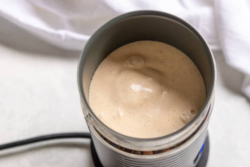 Pumpkin cream foamed up in electric Nespresso frother.