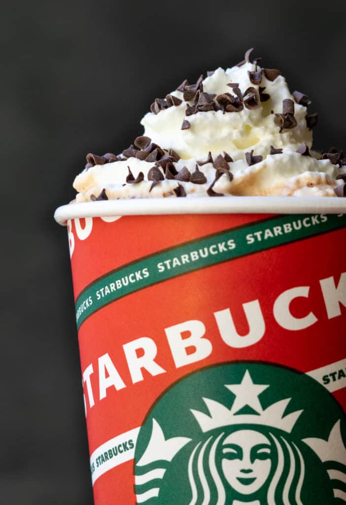 Starbucks Peppermint Mocha with whipped cream and chocolate curls for the holidays.