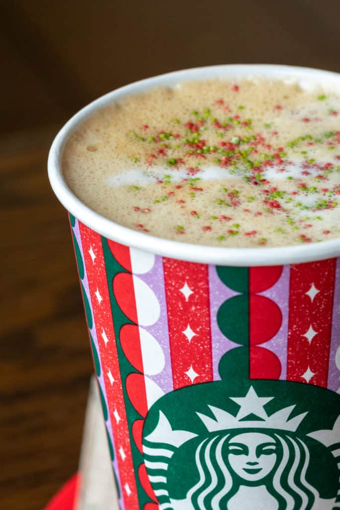 Starbucks sugar cookie latte topped with sprinkles.