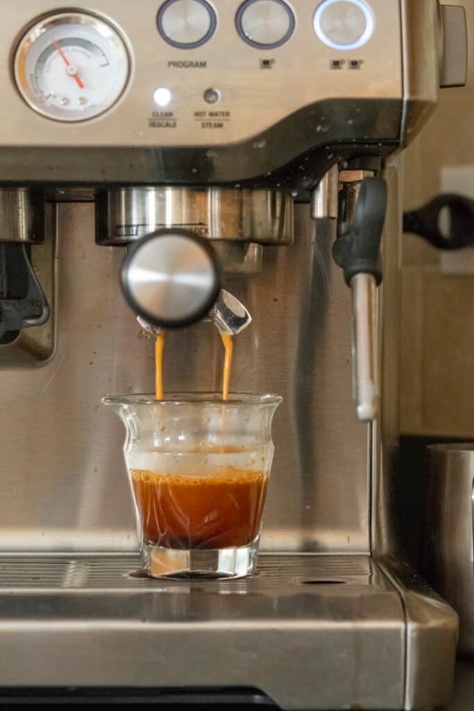 Starbucks blonde roast espresso being pulled from machine to make an iced blonde vanilla latte.