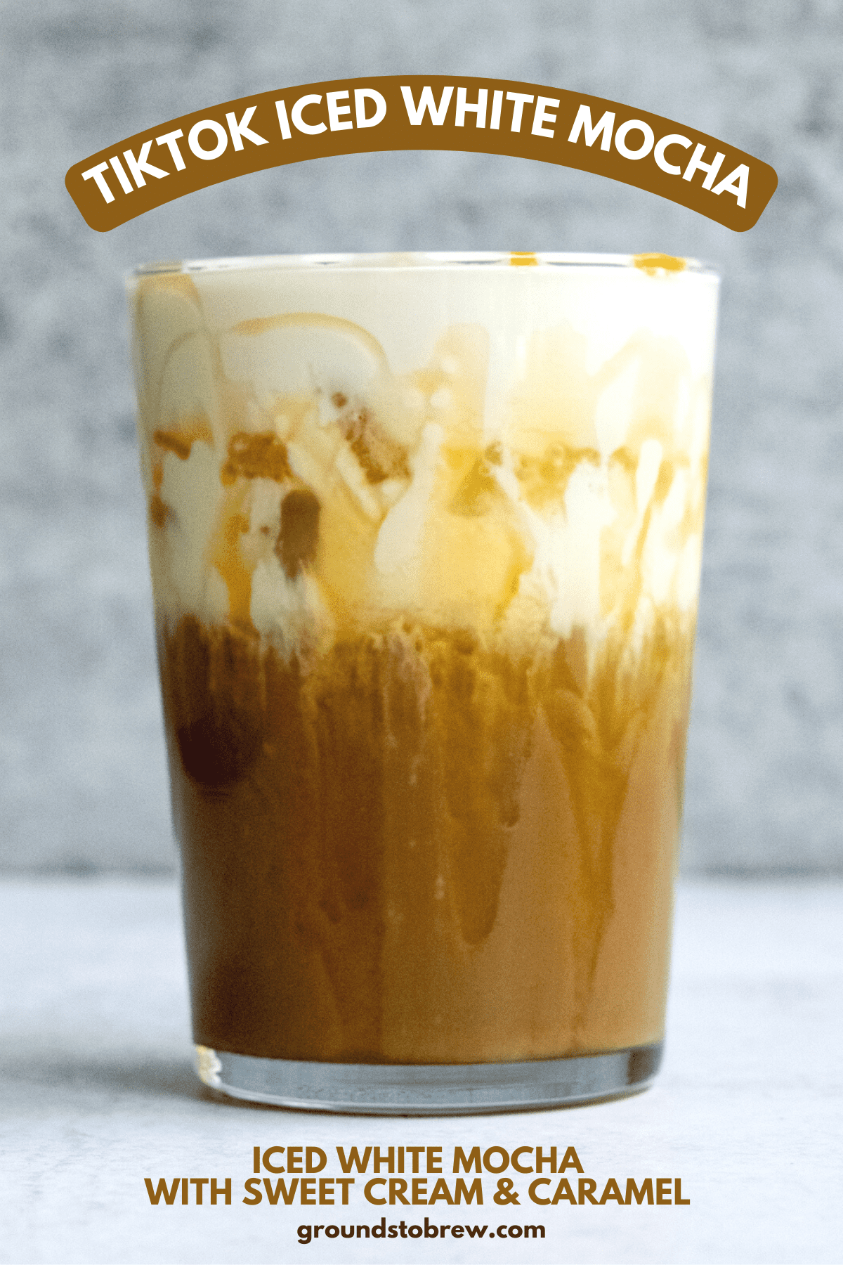 Copycat Starbucks Iced White Mocha topped with sweet cream foam and caramel drizzle.