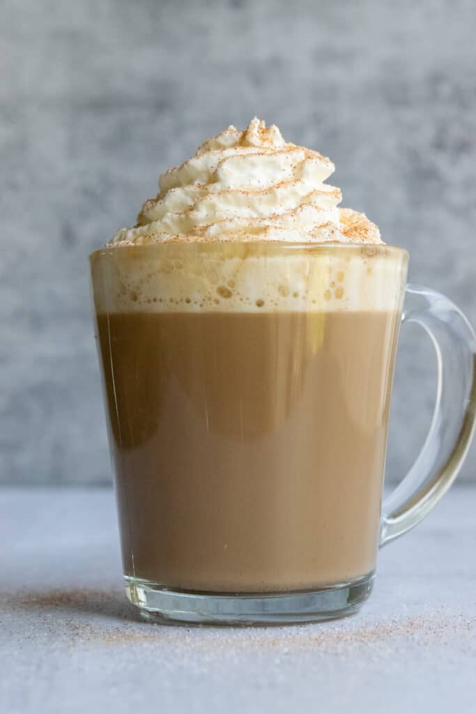 Copycat Starbucks Cinnamon Dolce Latte topped with whipped cream and cinnamon sugar.