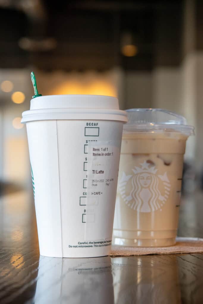 Tall Starbucks latte in a hot cup and a tall iced Caffe Latte.