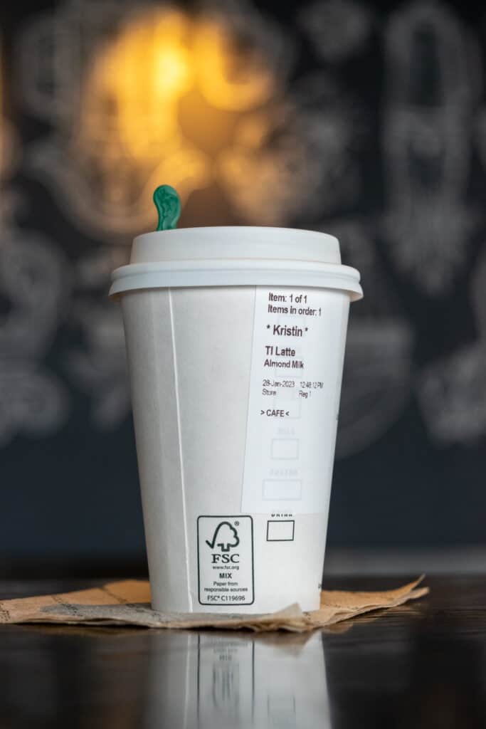 A tall size hot Starbucks Caffe Latte made with steamed almondmilk.