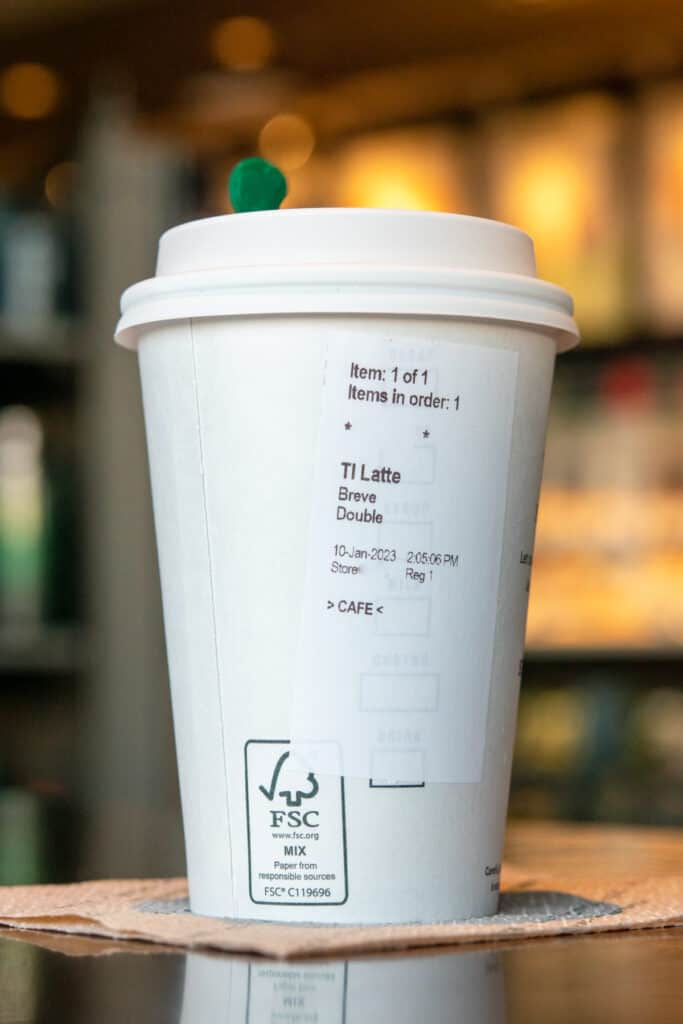 The order sticker on a Starbucks hot drink showing a Breve Latte.