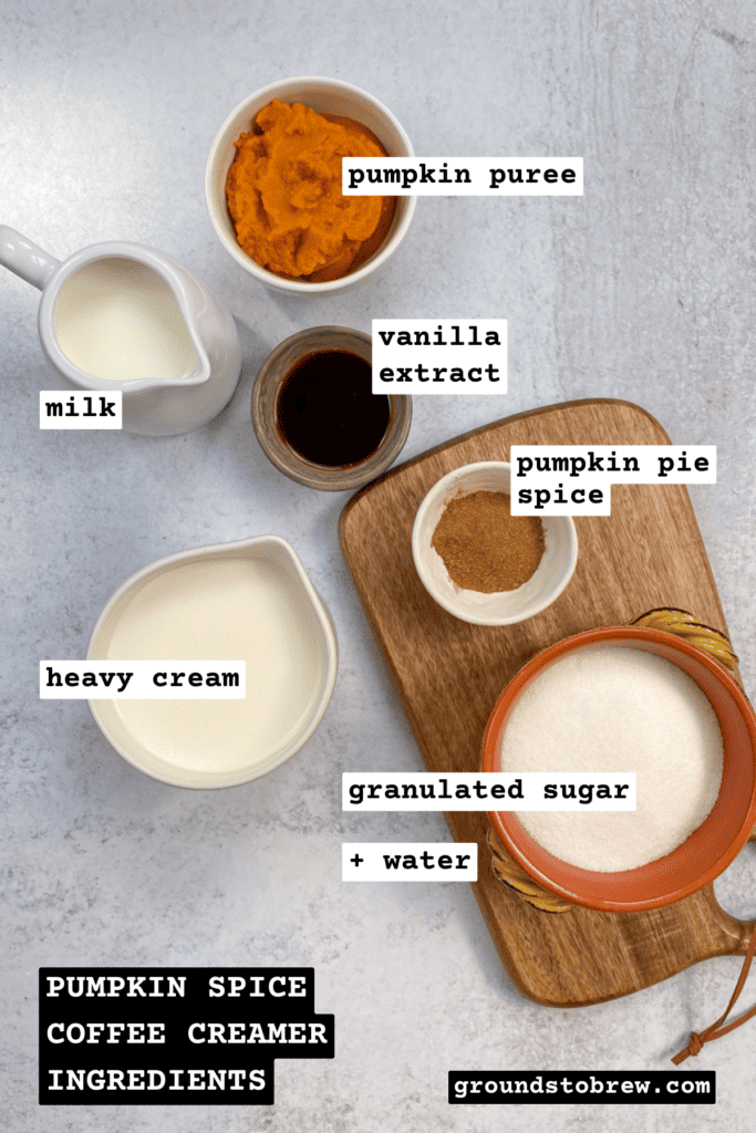 All the ingredients needed to make pumpkin spice creamer in bowls with a label saying what each ingredient is.