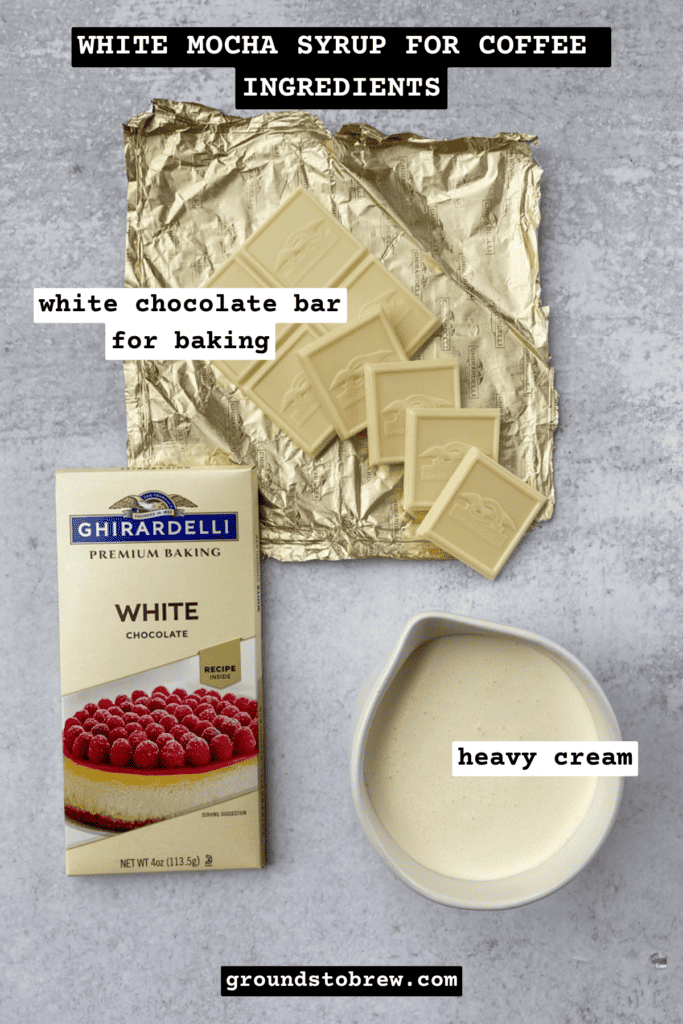 A Ghirardelli white chocolate baking bar that is open with squares of chocolate on the foil wrapper and a cup of heavy cream.