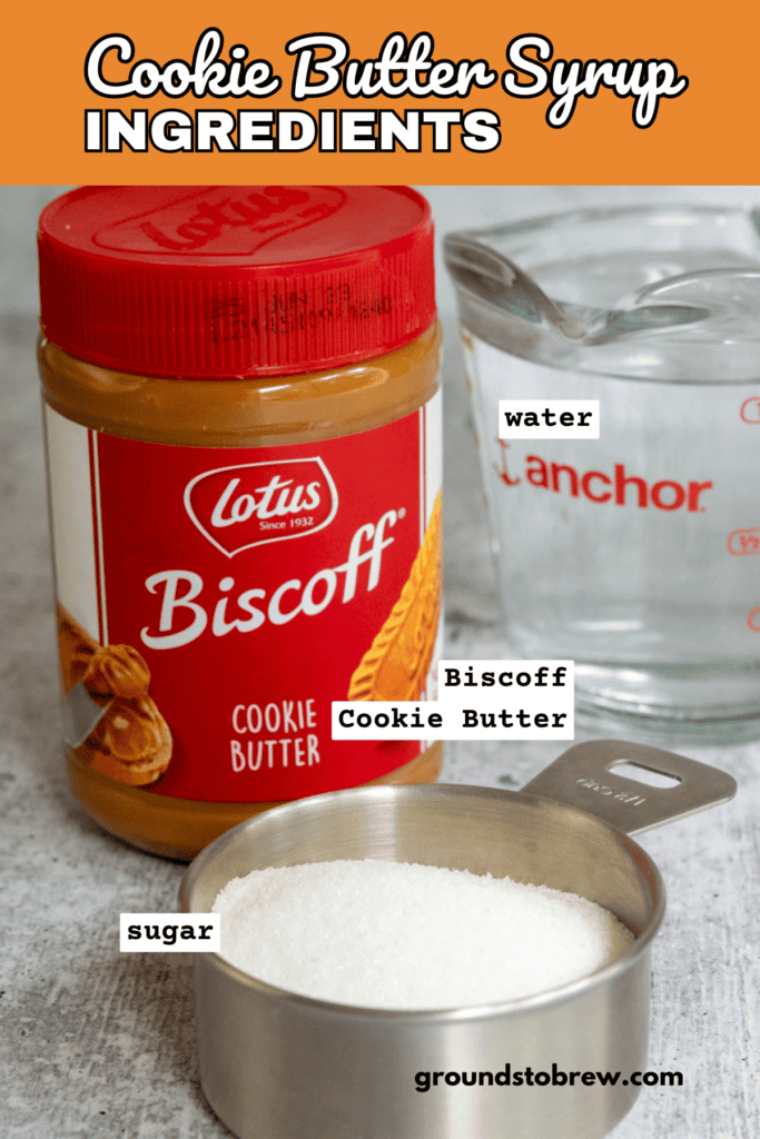 A jar of Biscoff cookie butter spread, some water in a glass measuring cup and some granulated white sugar.