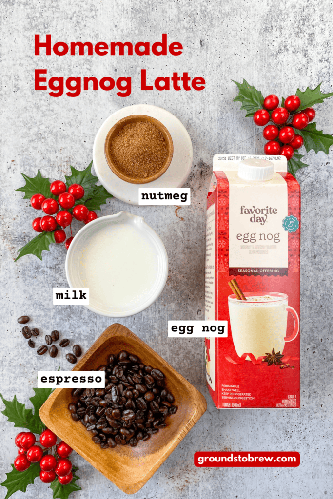 Overhead picture of the ingredients needed to make an eggnog latte, including carton of egg nog, espresso beans, ground nutmeg and milk.